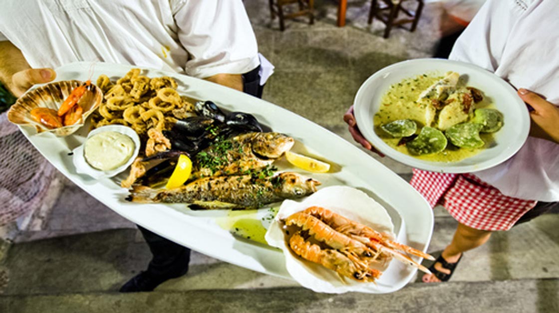 Traditional Croatian Food, including scampi, shells, fish, squid and more