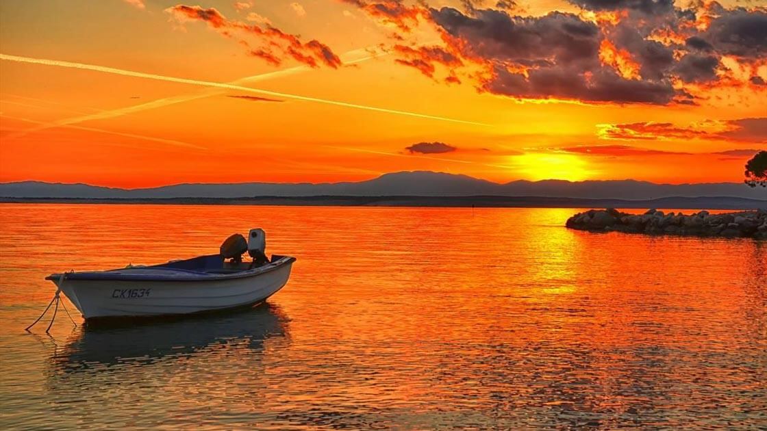 Sunset with a boat on the sea