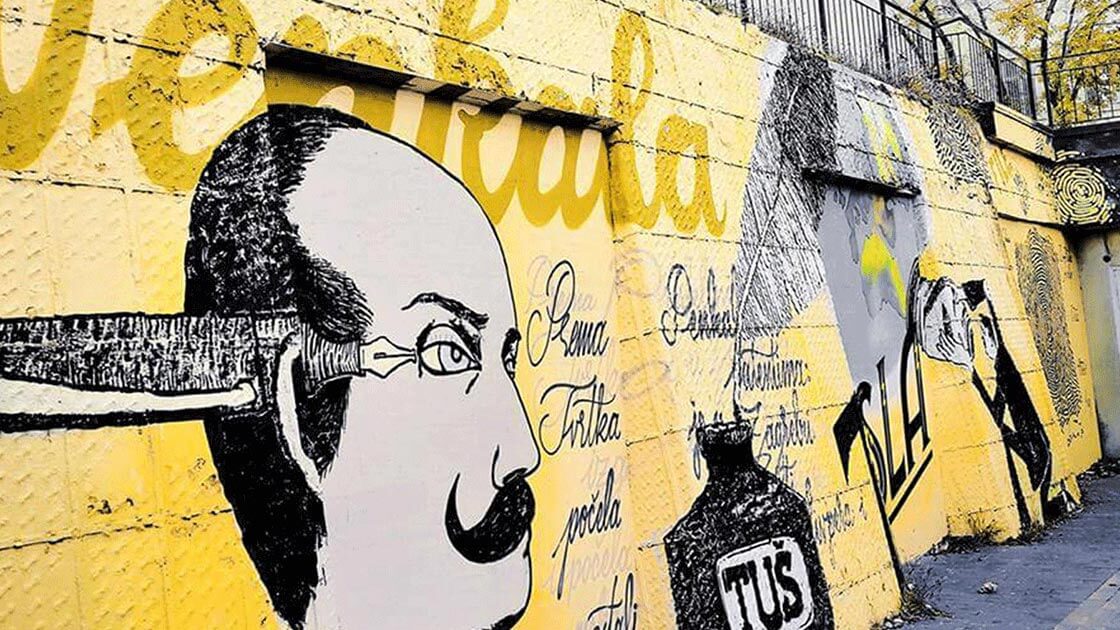 Yellow and black mural of Slavoljub Penkala in Zagreb